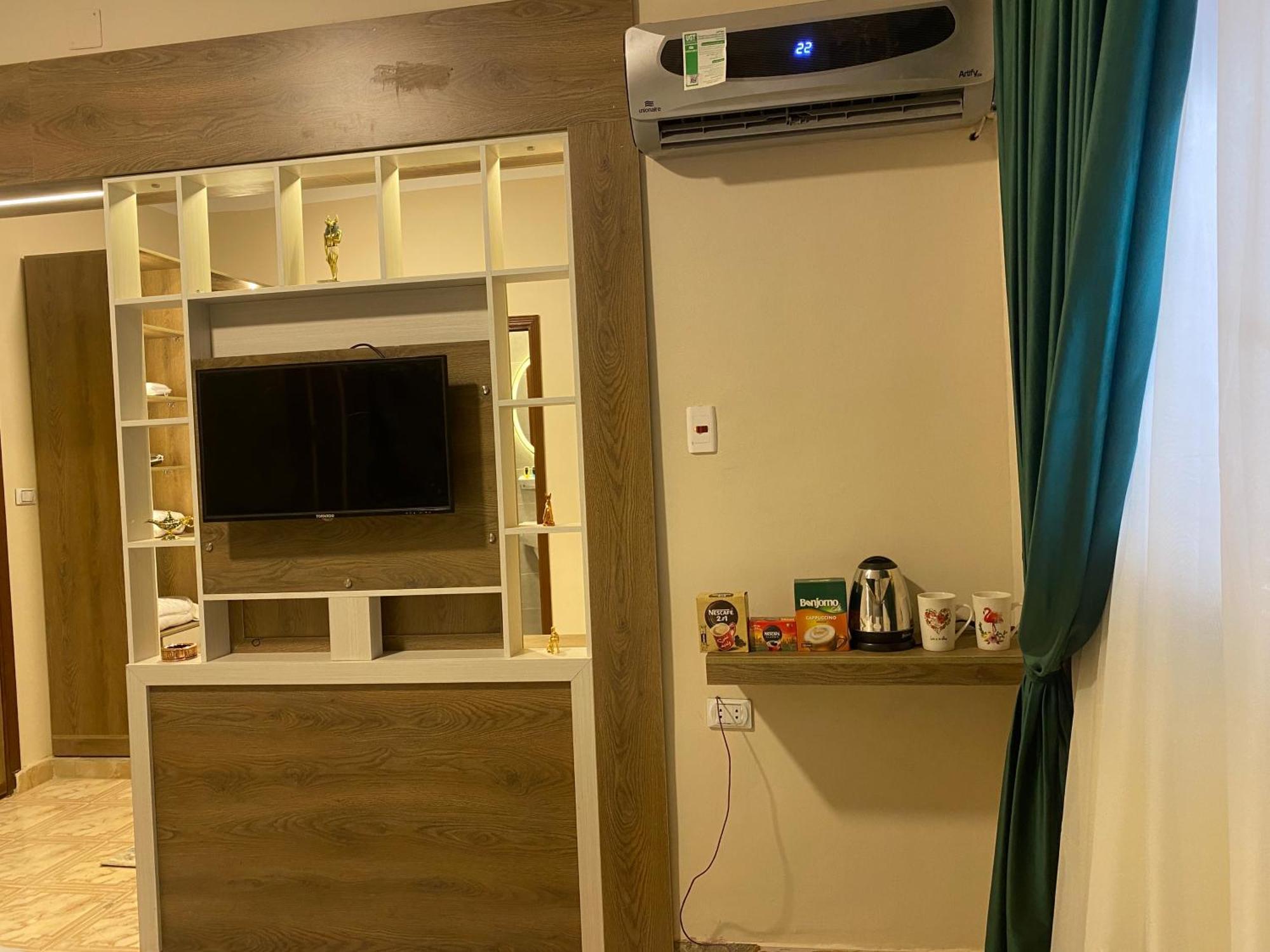 Global Pyramids Hotel Kafret el-Gabal エクステリア 写真